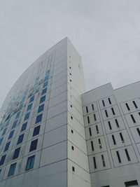 Low angle view of modern buildings against sky