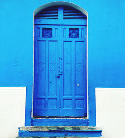 Closed blue door of building