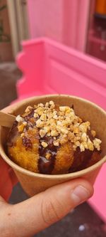 Close-up of hand holding ice cream