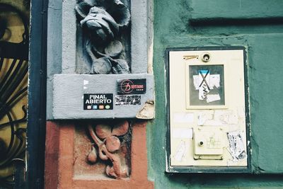 Close-up of information sign on door of building