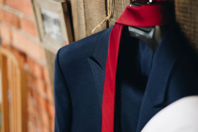 Close-up of suit hanging on store