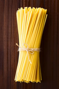 Close-up of yellow bread on wooden table