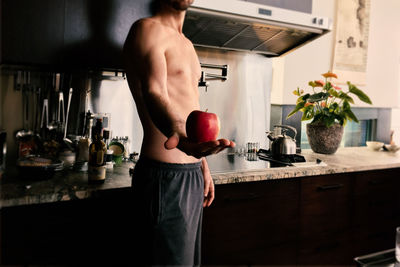 Midsection of man preparing food at home