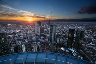 High angle view of main tower and cityscape during sunset