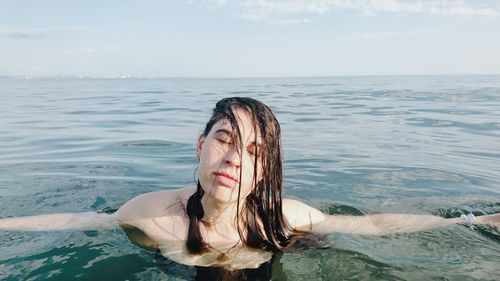 Young woman swimming in pool