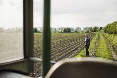 Farmer standing at a field