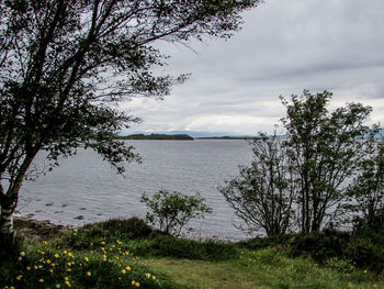 View of lake against cloudy sky