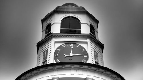 Low angle view of clock tower against sky