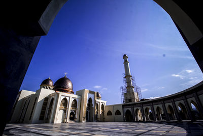 Low angle view of building against blue sky