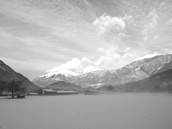 Scenic view of snowcapped mountains against sky