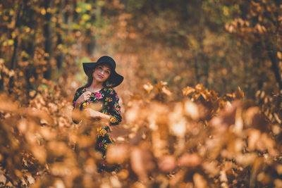 Portrait of young woman in hat