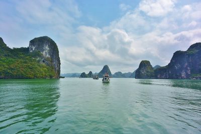 Panoramic view of sea and mountains against sky