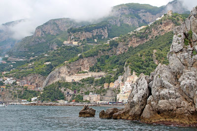 Scenic view of river with mountains in background