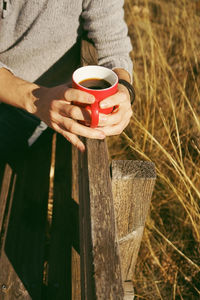 Man holding coffee cup