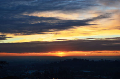 Scenic view of dramatic sky during sunset