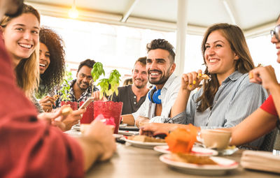 Friends enjoying at table