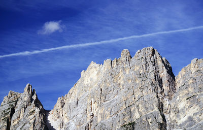 Low angle view of rock formation against sky