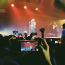 Woman photographing through smart phone