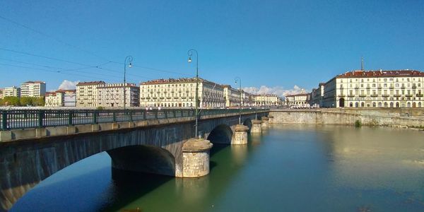 Bridge over river against clear sky