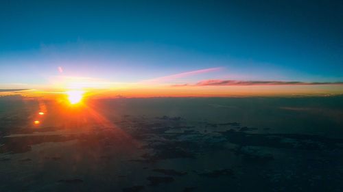 Aerial view of landscape against sky during sunset