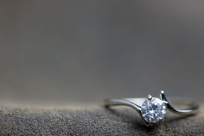 Close-up of wedding rings on table