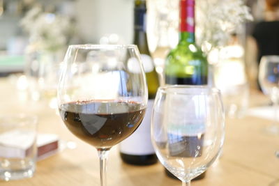 Close-up of wineglass on table at home