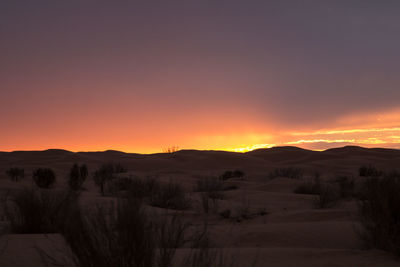 Scenic view of mountains at sunset