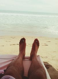 Low section of woman on beach