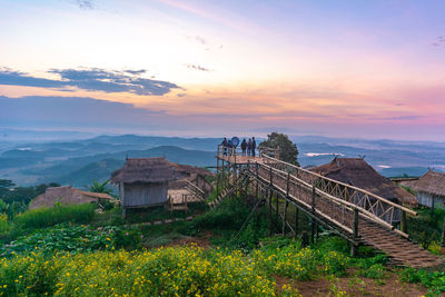 Scenic view of buildings against sky during sunset