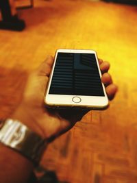 Close-up of man using mobile phone