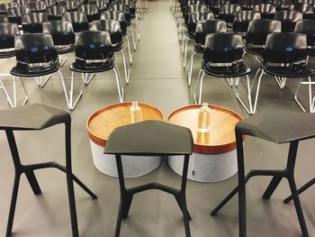 High angle view of empty chairs arranged in school