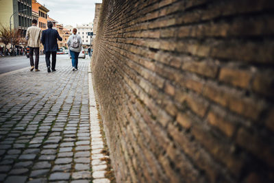 People walking on road in city