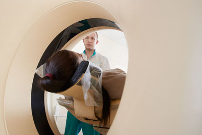 Doctor preparing patient for mri