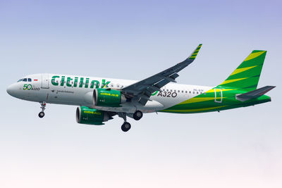 Low angle view of airplane against clear sky