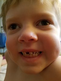 Close-up portrait of smiling boy