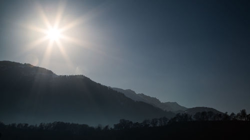 Scenic view of silhouette mountains against sky