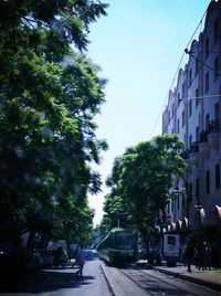 Road along buildings in city