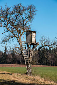 Built structure on field against sky
