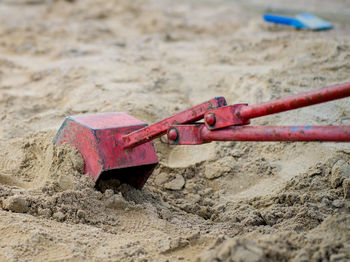 Close-up of metallic structure on sand