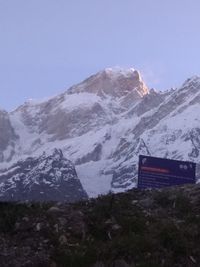 Scenic view of snowcapped mountains against clear sky
