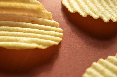 Close-up of potato chips on table