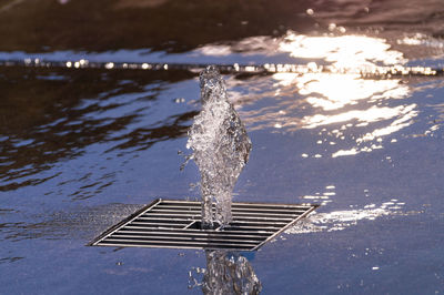 Close-up of water splashing on white background