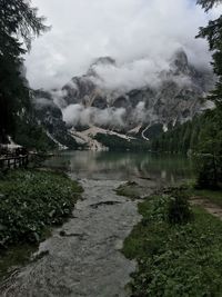 Scenic view of lake and mountains against sky