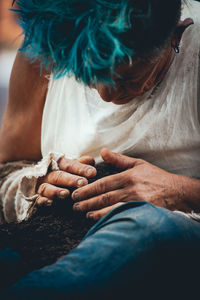 High angle view of woman sitting on floor