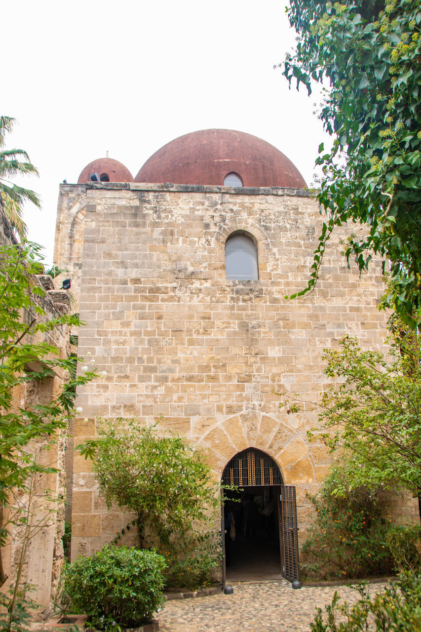 architecture, built structure, building exterior, building, place of worship, plant, arch, nature, tree, history, the past, religion, travel destinations, no people, travel, tourism, entrance, belief, outdoors, day, fortification, sky, wall, spirituality, old, door, clear sky