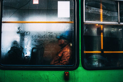 Man seen through train window