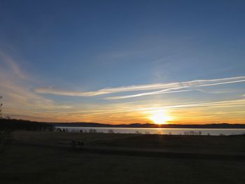 Scenic view of beach against sky during sunset