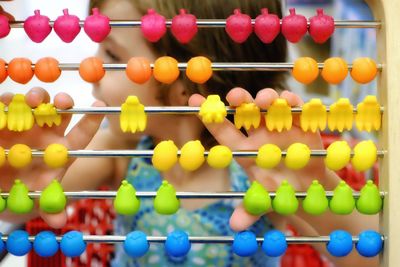 Girl playing with abacus at home
