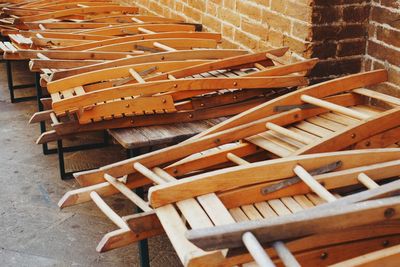 High angle view of folded wooden chairs