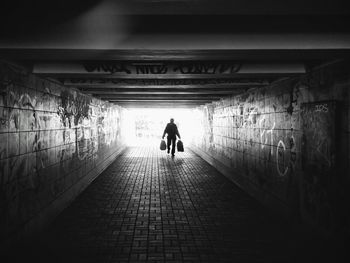 Man walking in tunnel